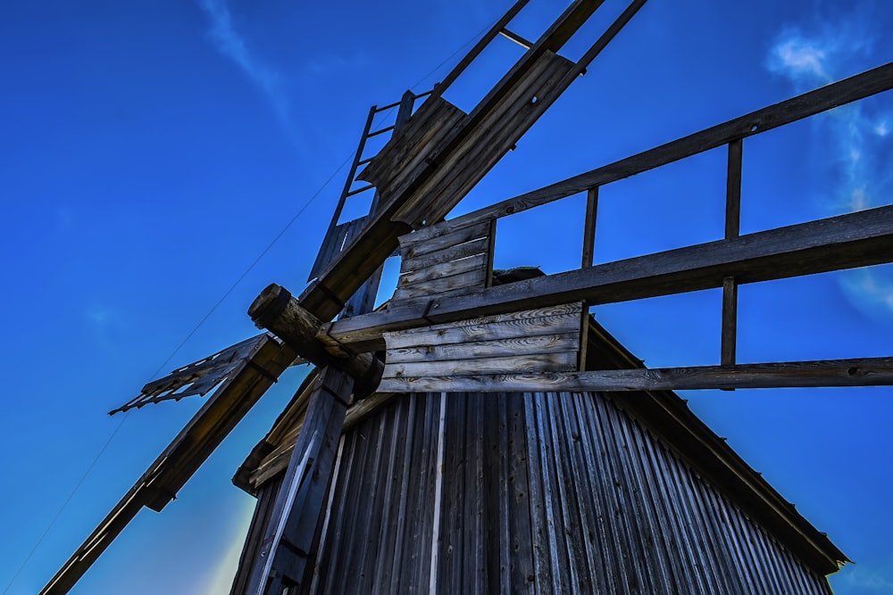 a wooden structure with a metal fence around it