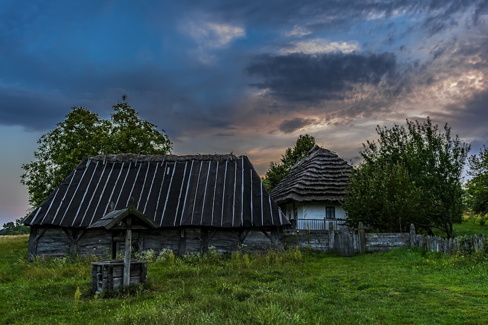 an old wooden house with a metal roof