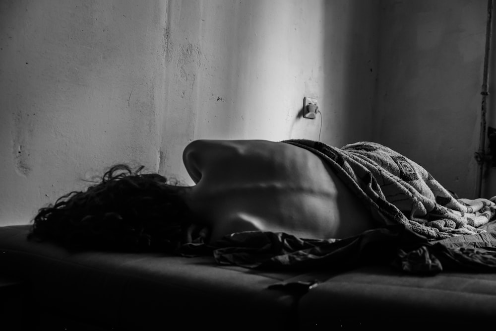 a black and white photo of a mannequin's head