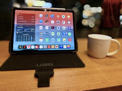 Close-up of a tablet displaying a custom app for a neighborhood cafe.