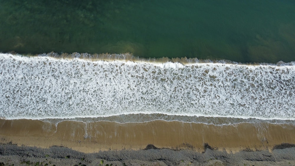 an aerial view of a beach and ocean