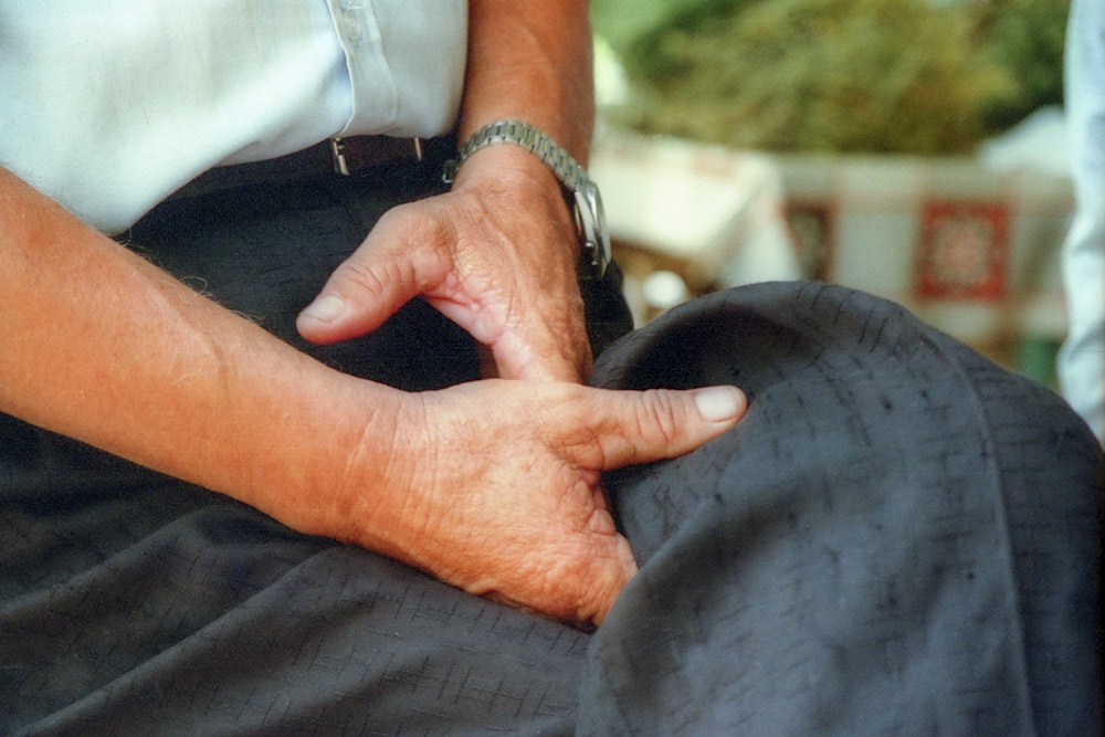 a person with their hands on their knees