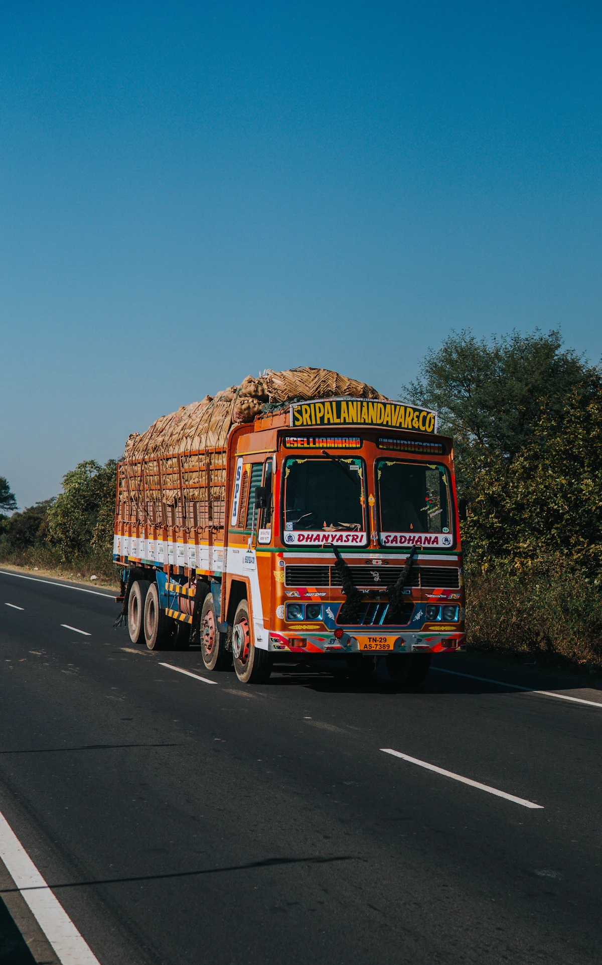 A colourfully painted goods truck on an Indian highway