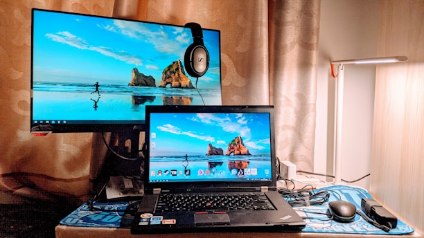 a laptop computer sitting on top of a desk
