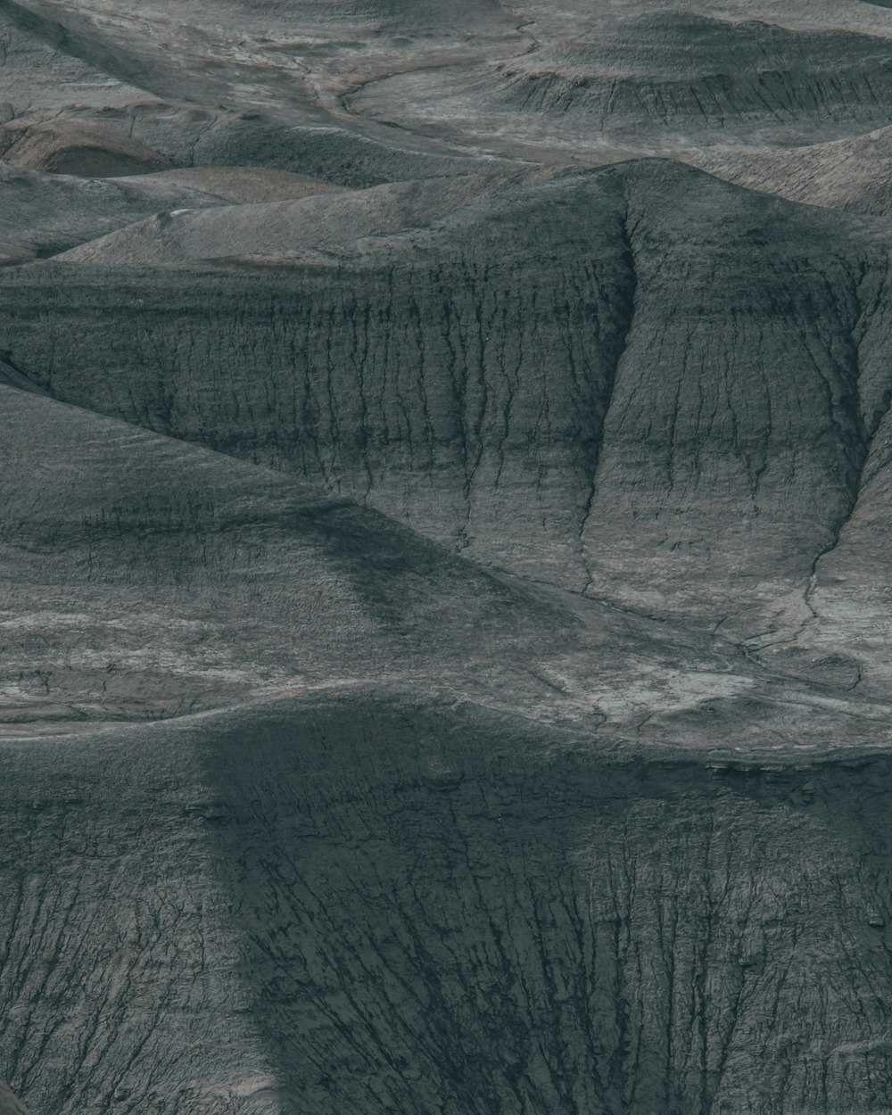 an aerial view of a mountain range in the desert