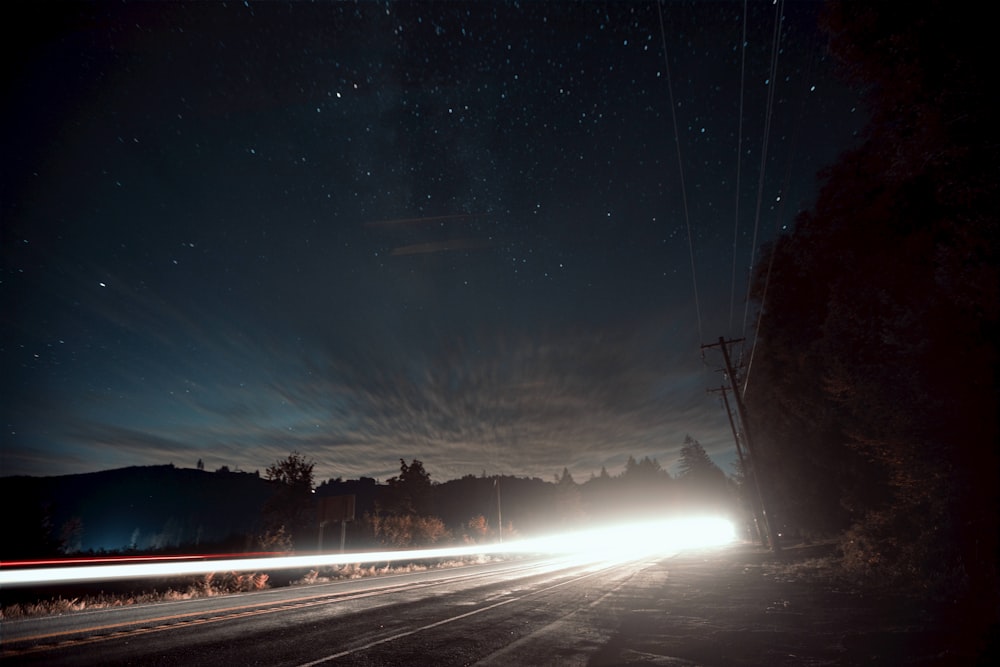 a car driving down a road at night