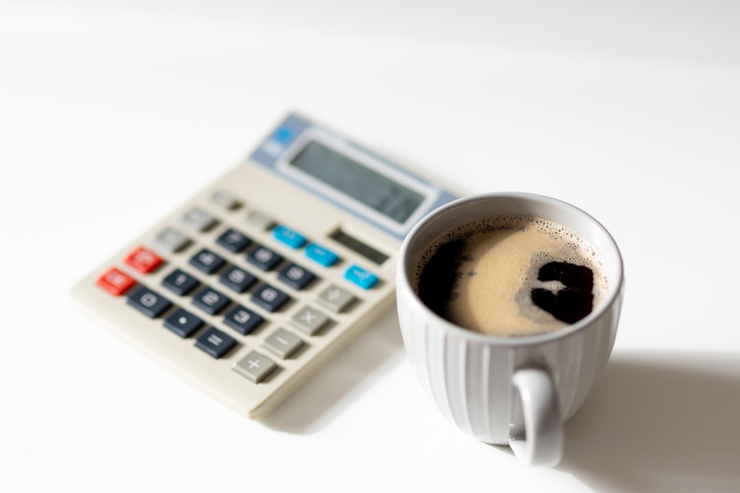 Cup of coffee and calculator - Average Order Value (AOV) - Photo by Ben Wicks | best digital marketing - London, Bristol and Bath marketing agency