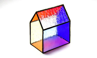 a multicolored cube sitting on top of a white table