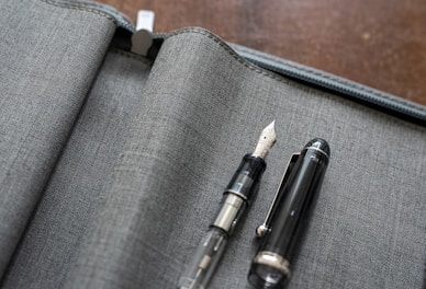 a pen sitting on top of a piece of fabric