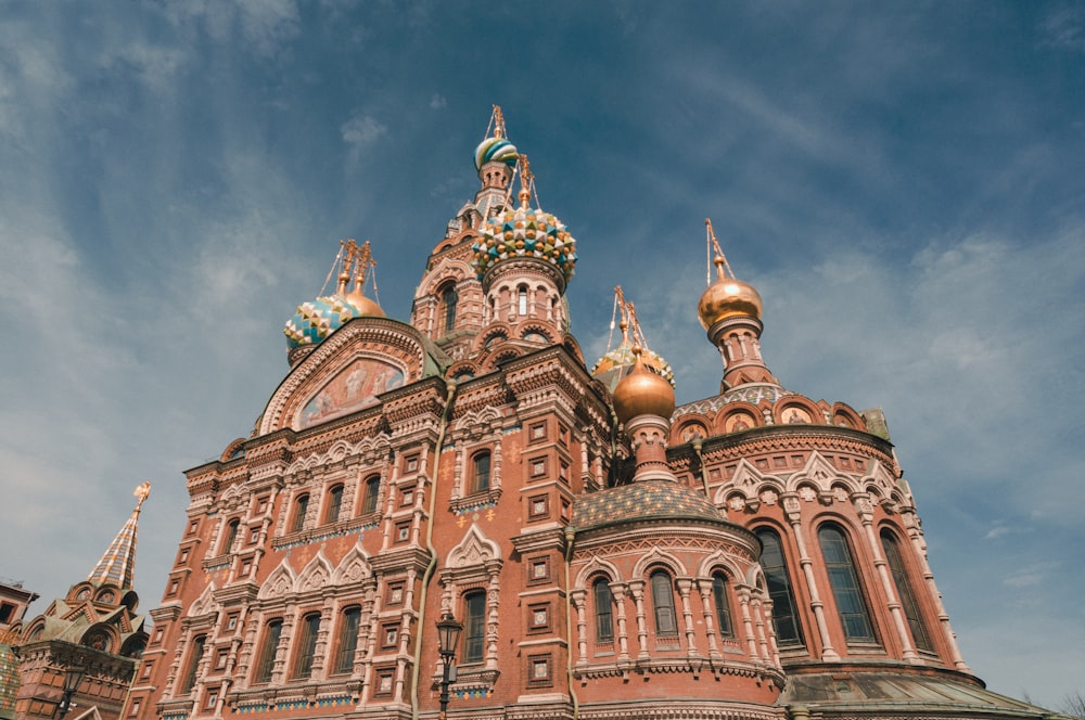 a large building with gold domes on top of it