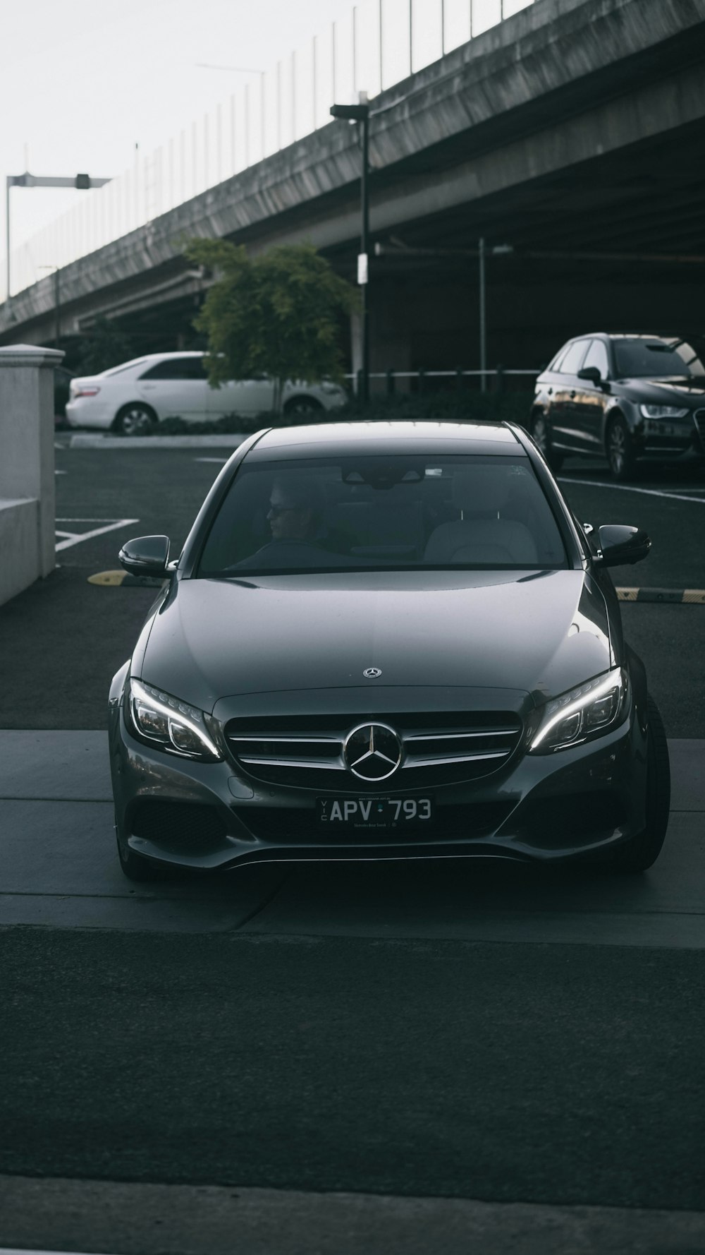 a black car parked on the side of the road