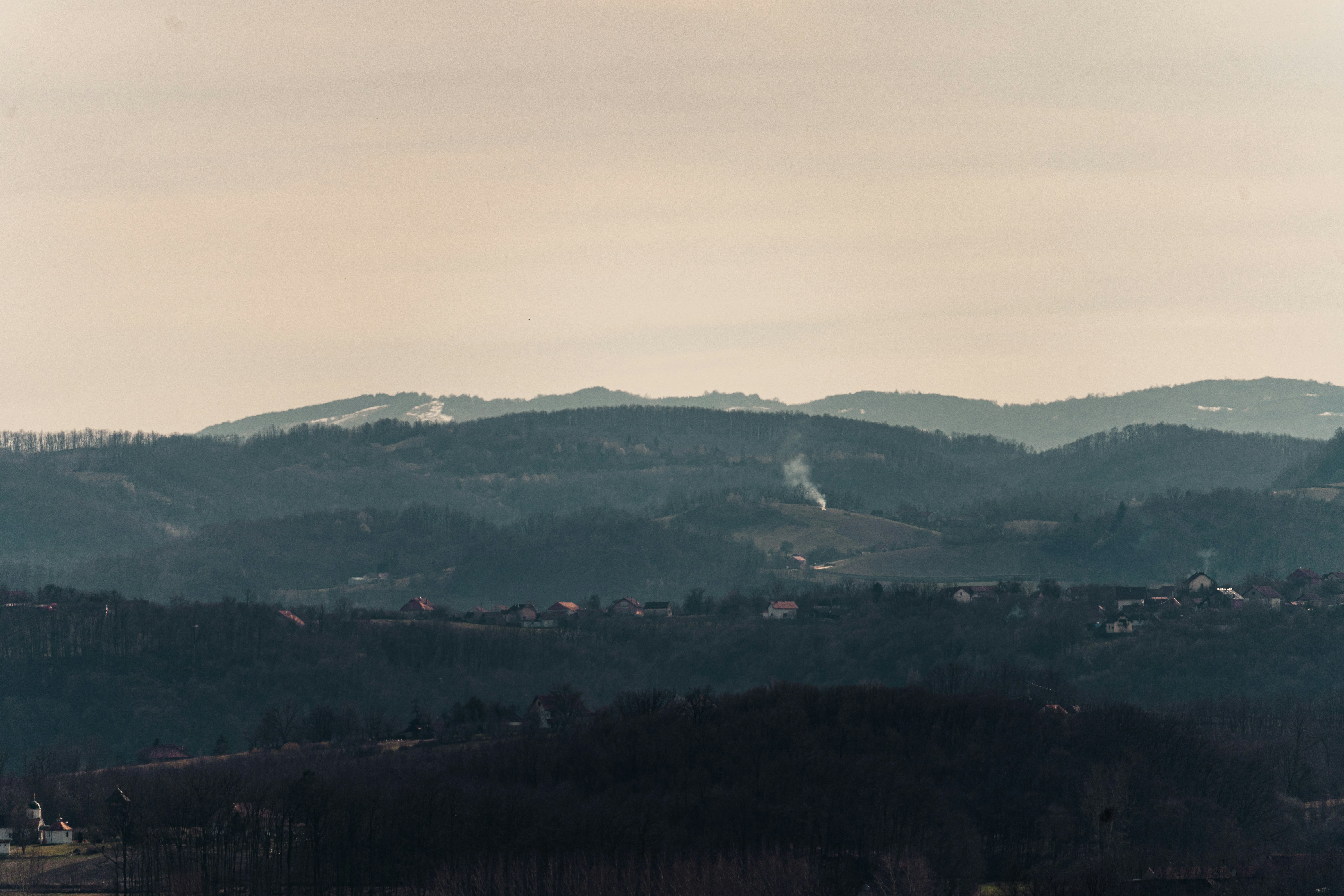a view of a mountain range with a town in the distance