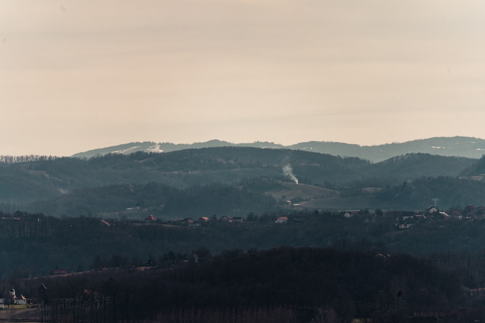 a view of a mountain range with a town in the distance