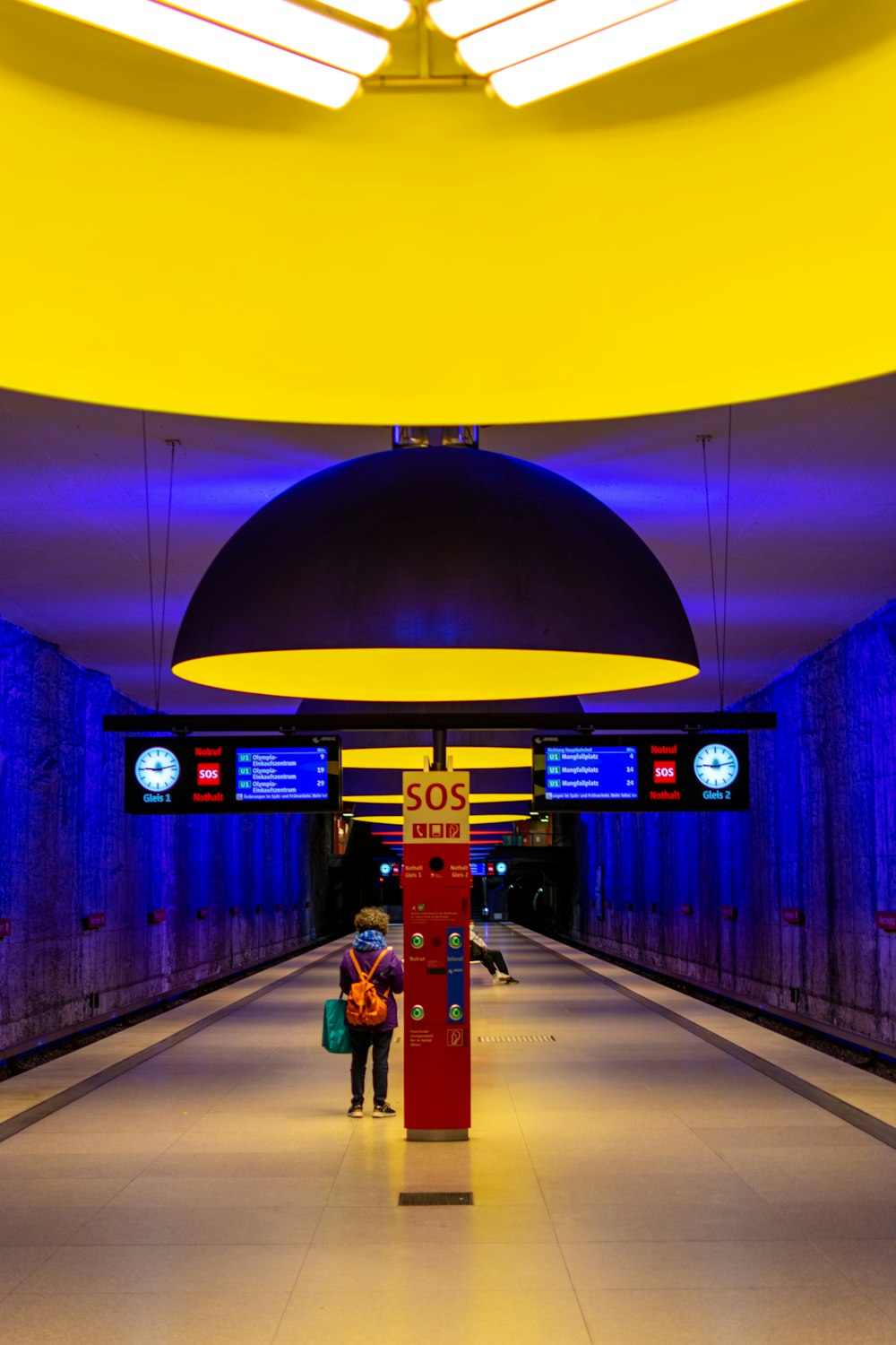 a person is walking down a long hallway