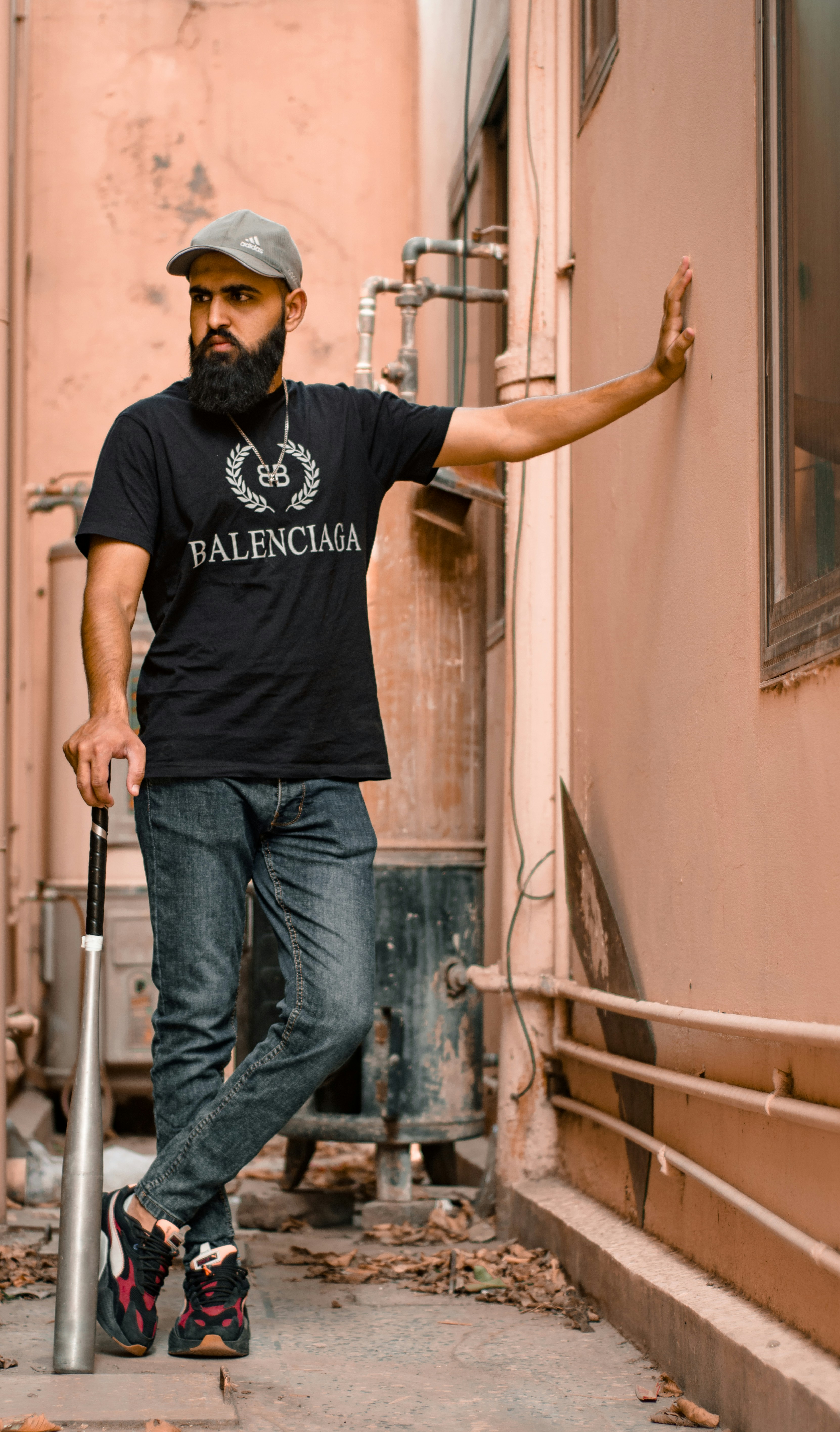 a man with a beard holding a baseball bat