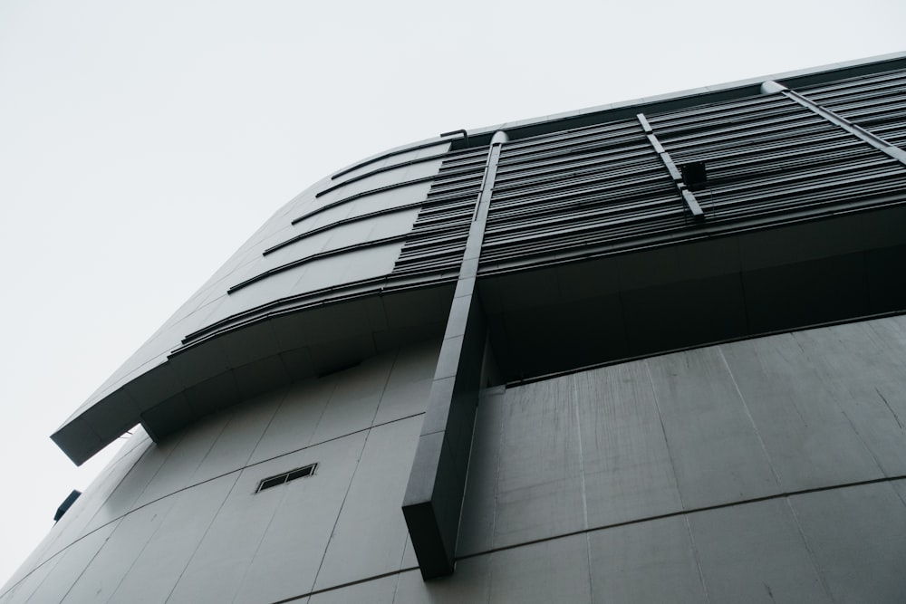 a tall building with a sky in the background