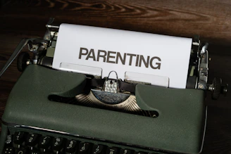 a close up of a typewriter with a paper on it