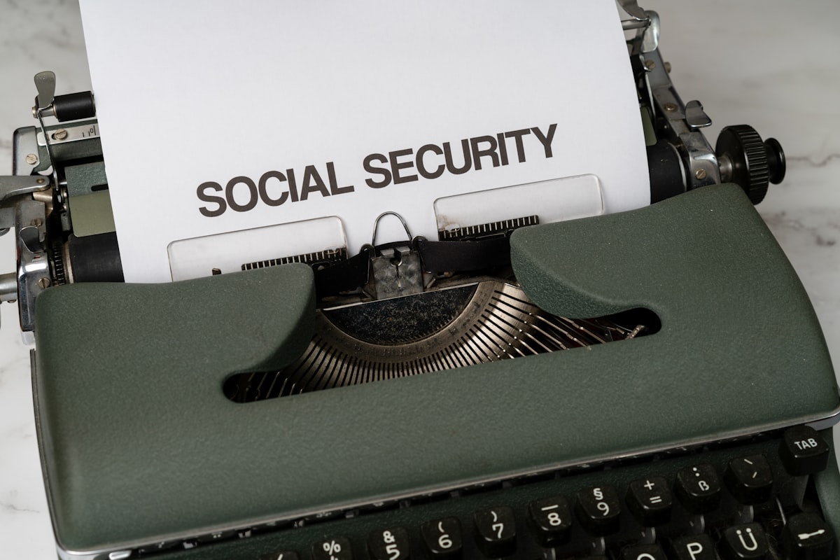 A close-up of a typewriter with a paper that reads Social Security