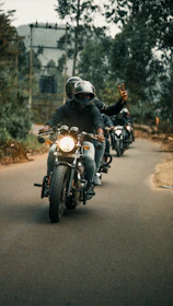 Members of the Red Dragon Brotherhood riding in formation along a coastal road.