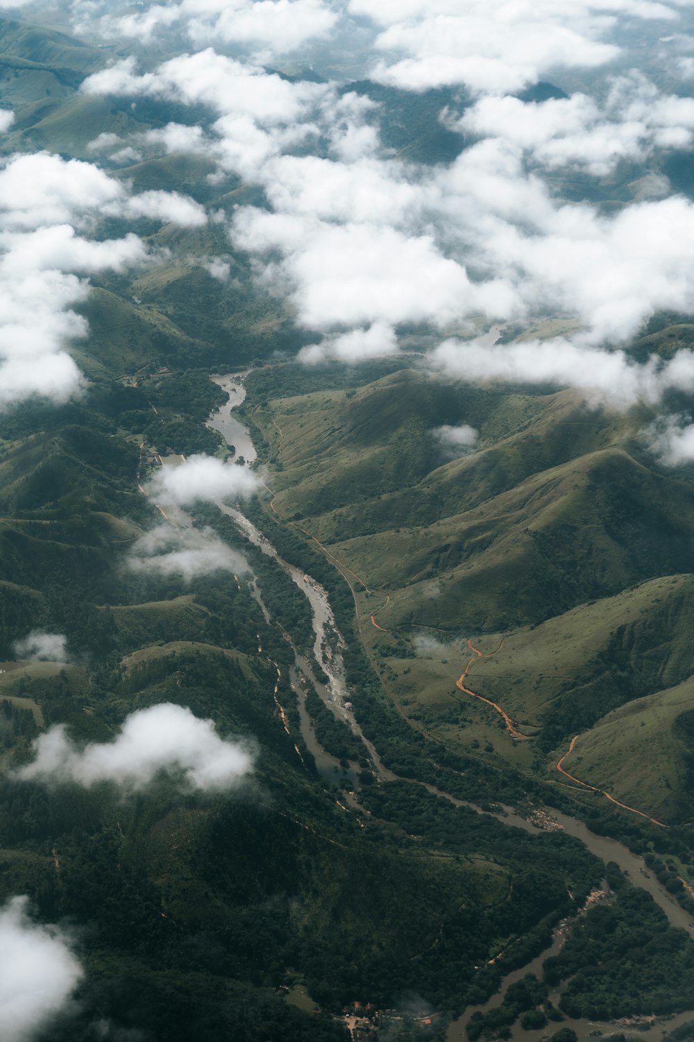 an aerial view of a river running through a valley