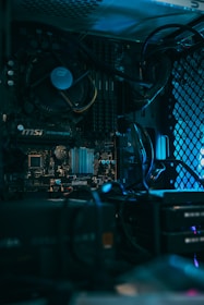 a close up of a computer motherboard with many wires