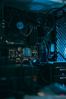 a close up of a computer motherboard with many wires