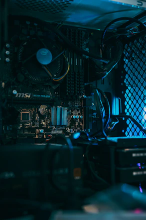 a close up of a computer motherboard with many wires