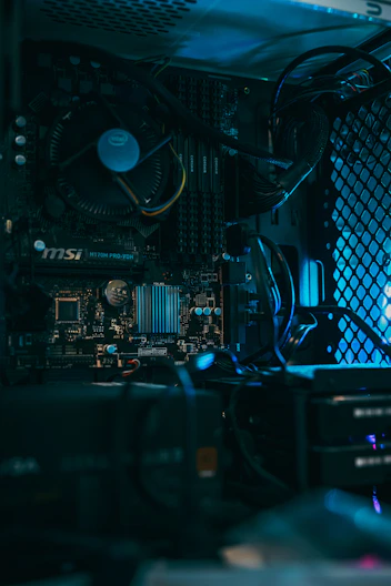 a close up of a computer motherboard with many wires