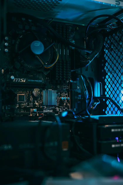 a close up of a computer motherboard with many wires