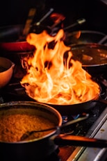 a bowl of food cooking on a stove