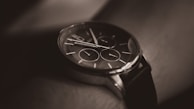 A close-up of a fashionable watch on a man's wrist.