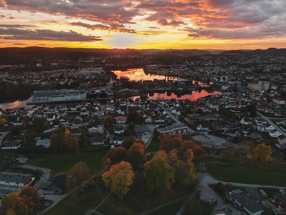 an aerial view of a city at sunset