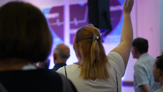 a woman raising her arms in the air