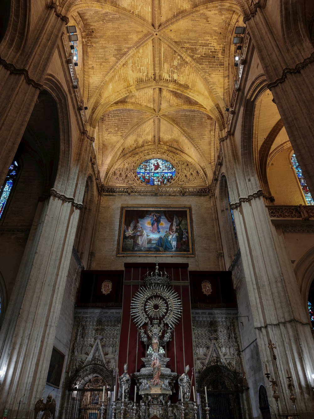 a large cathedral with a high vaulted ceiling and stained glass windows