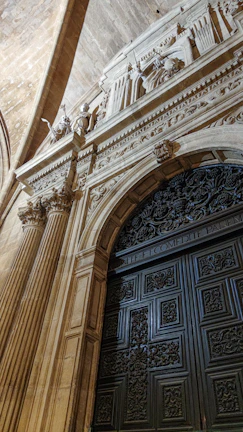 An elegant doorway framed by aged stone, showcasing timeless craftsmanship.