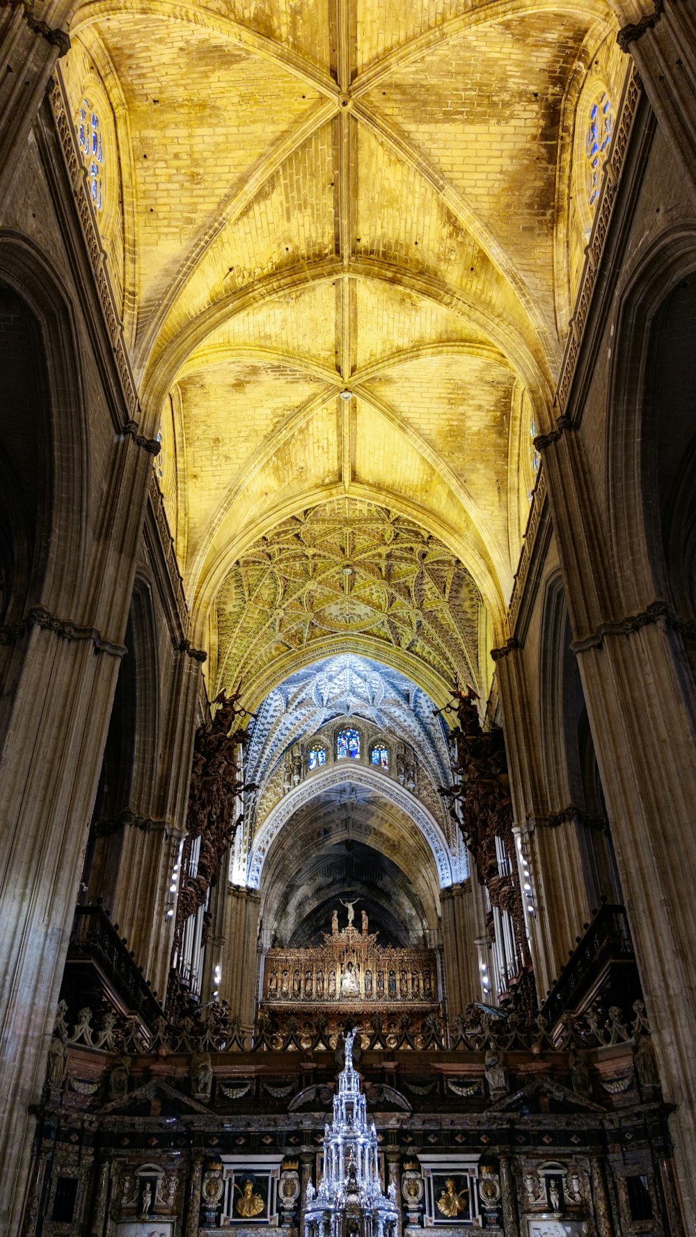 a large cathedral with a vaulted ceiling and high columns
