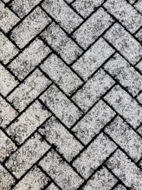 Close-up of textured pavers arranged in a neat pattern outdoors.