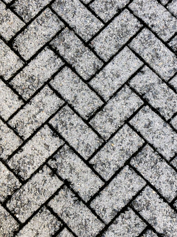 Close-up of a freshly finished paver surface treated with Escon Chemical Co products, showcasing smooth texture and vibrant color.