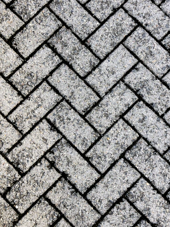 Close-up of durable pavers arranged on a construction site ready for installation.