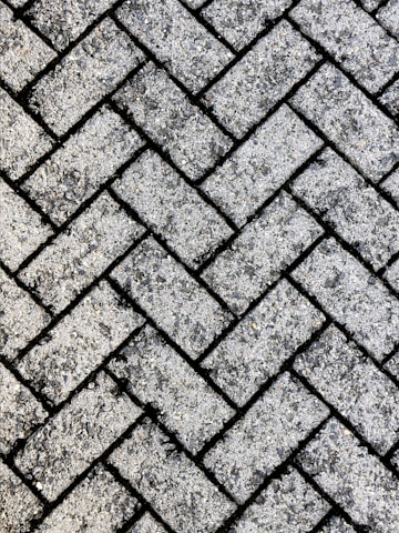 Close-up of textured pavers arranged in a neat pattern outdoors.