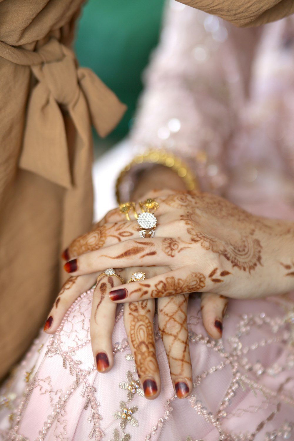 a close up of a person's hands with hennap