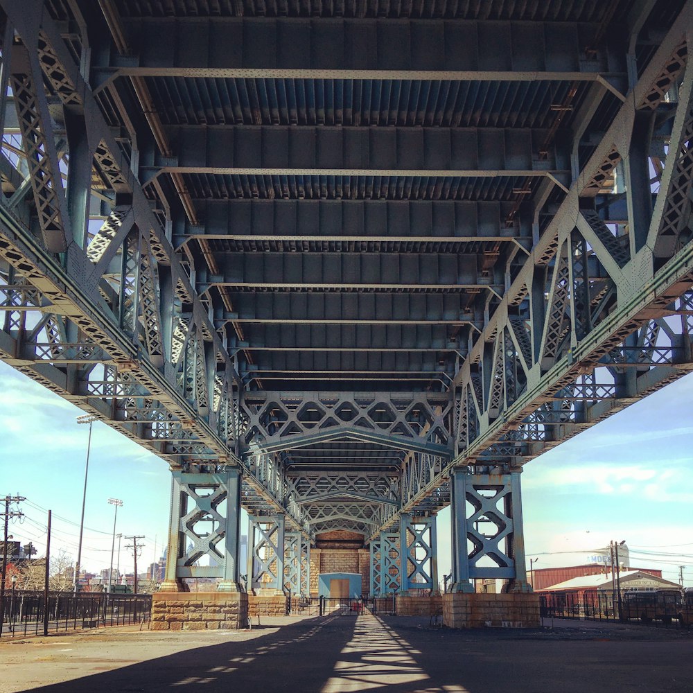 a view of a bridge from the bottom of it