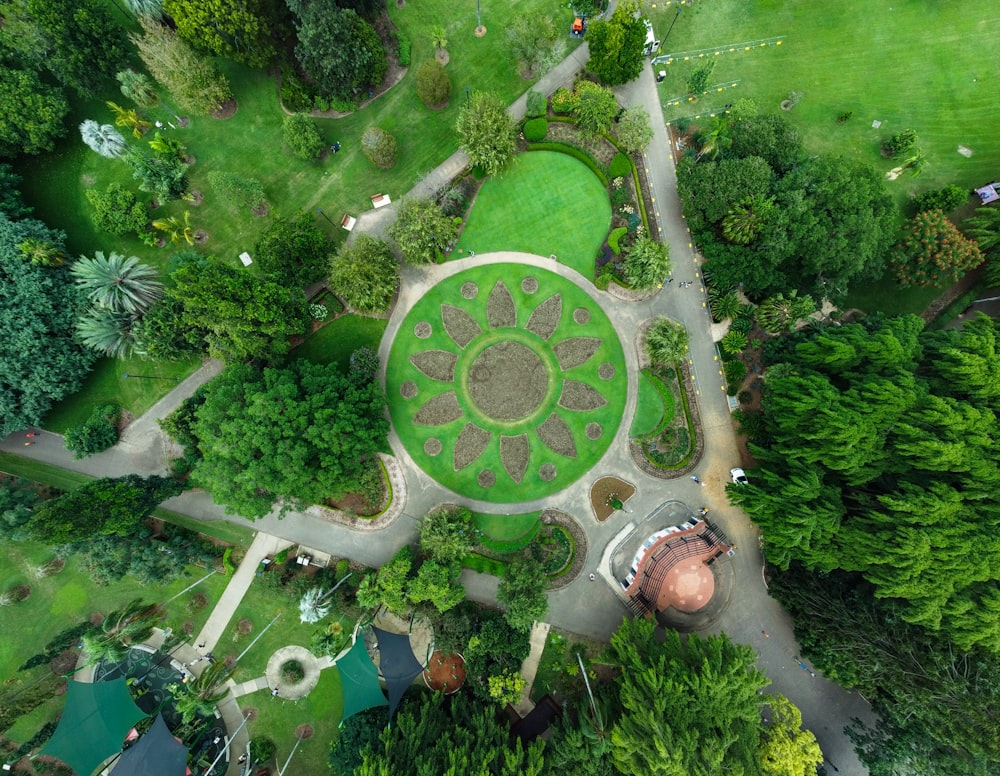 an aerial view of a circular garden in a park