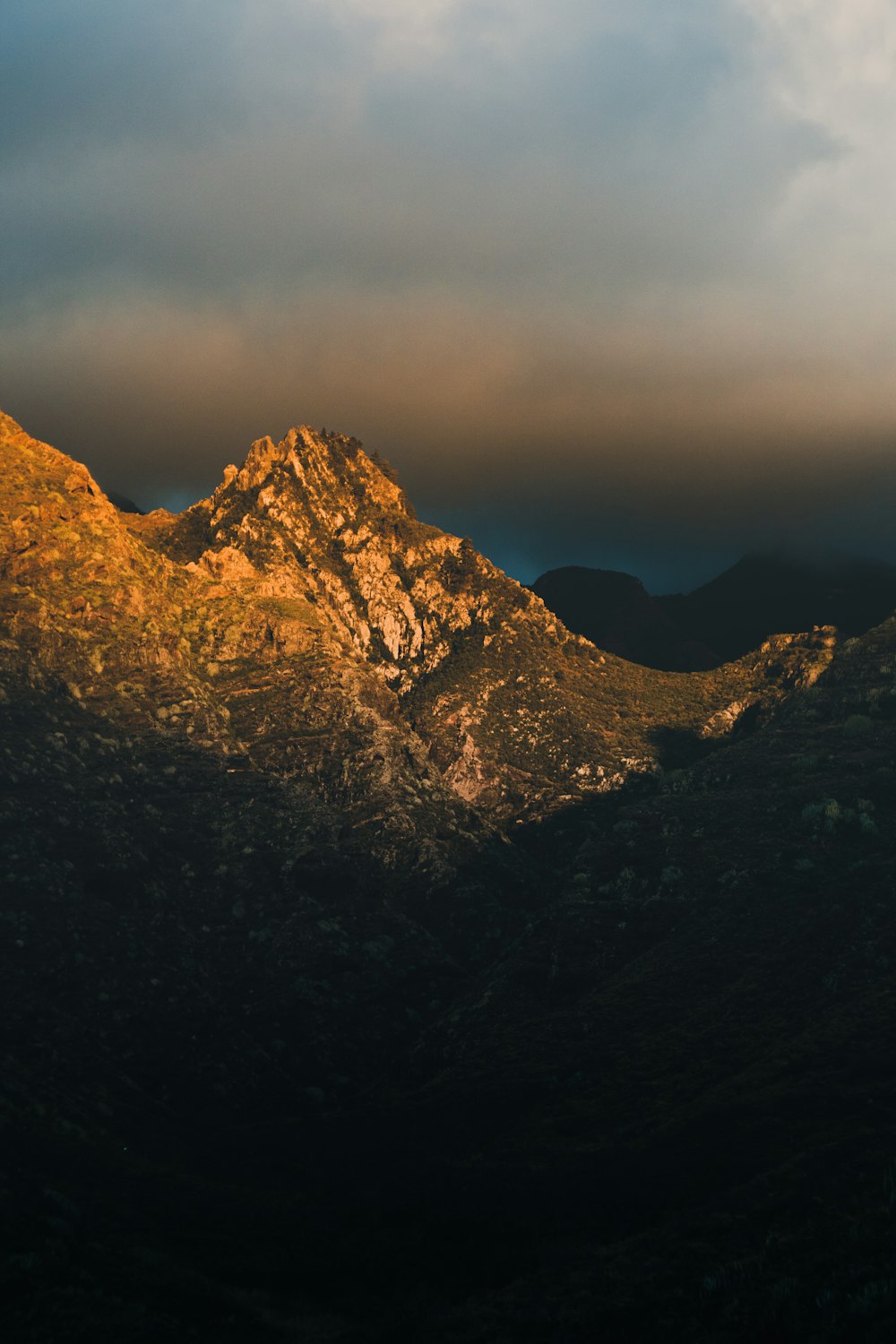 a view of a mountain range at sunset