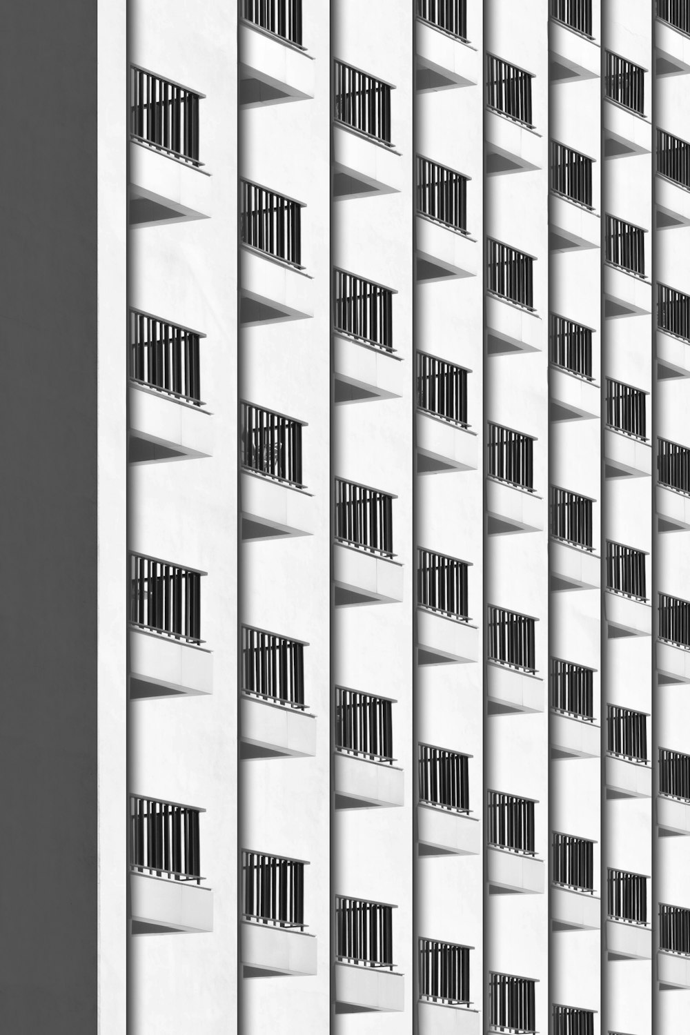 a black and white photo of a tall building