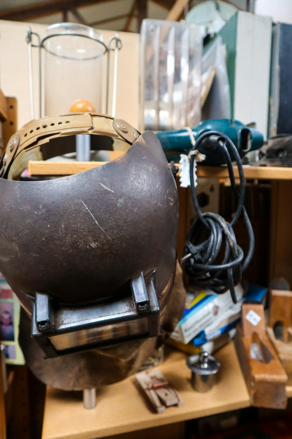 a helmet sitting on top of a wooden table