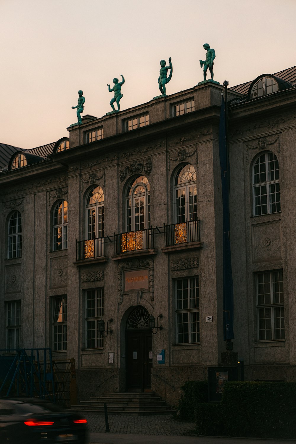 a large building with statues on top of it