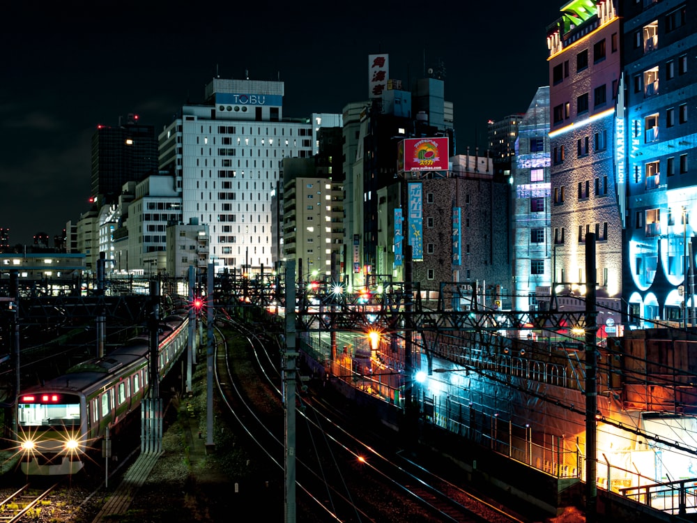 a train traveling through a city at night