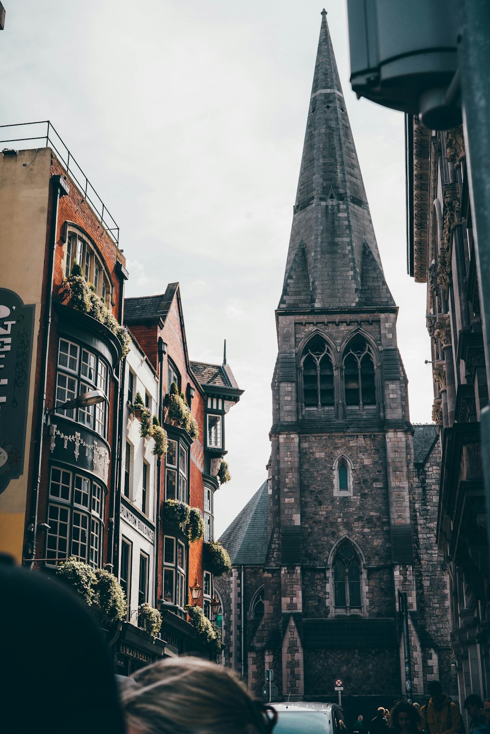 a church steeple towering over a city filled with tall buildings