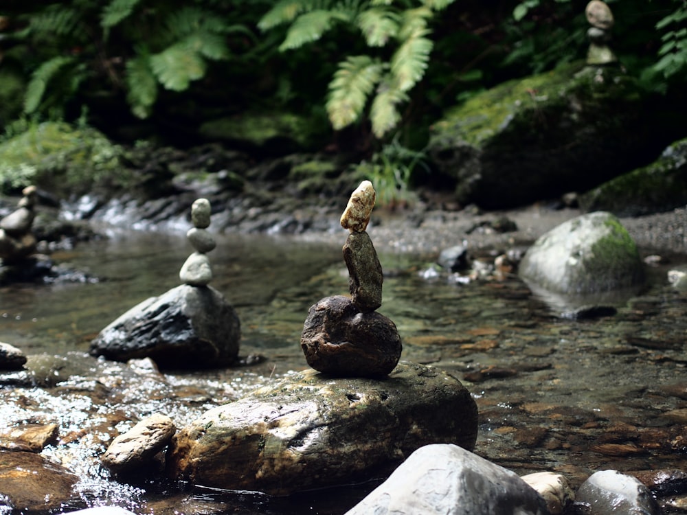 rocks stacked on top of each other in a stream